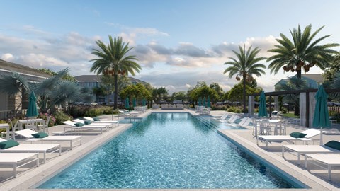 A large swimming pool surrounded by lounge chairs and palm trees. at Allegra at Cocoa in Cocoa, FL, 32926