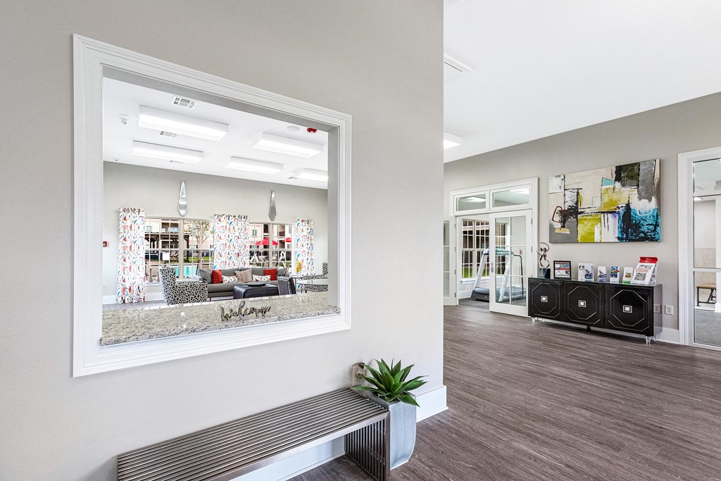 Welcome to the Reagan Crossing leasing office and resident clubhouse with bench and chairs