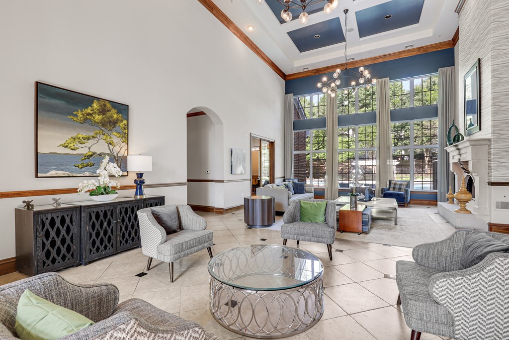 a living room filled with furniture and a large window