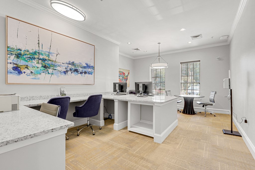 an office with two desks and two computers