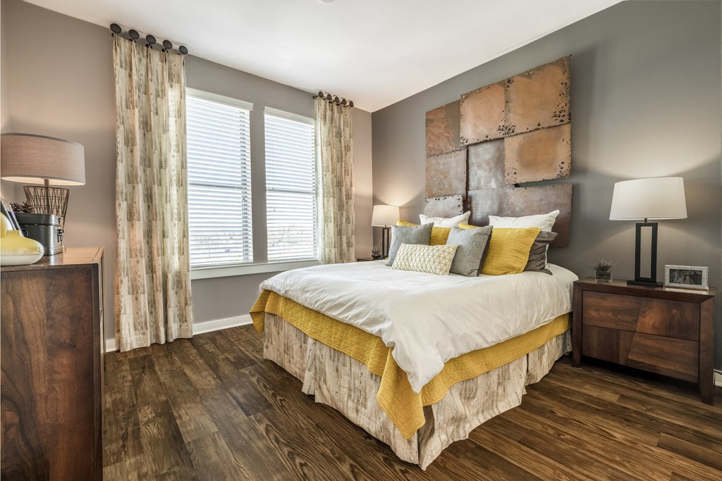 Bedroom with wood-designed flooring and large window at Liberty Mill in Germantown, MD