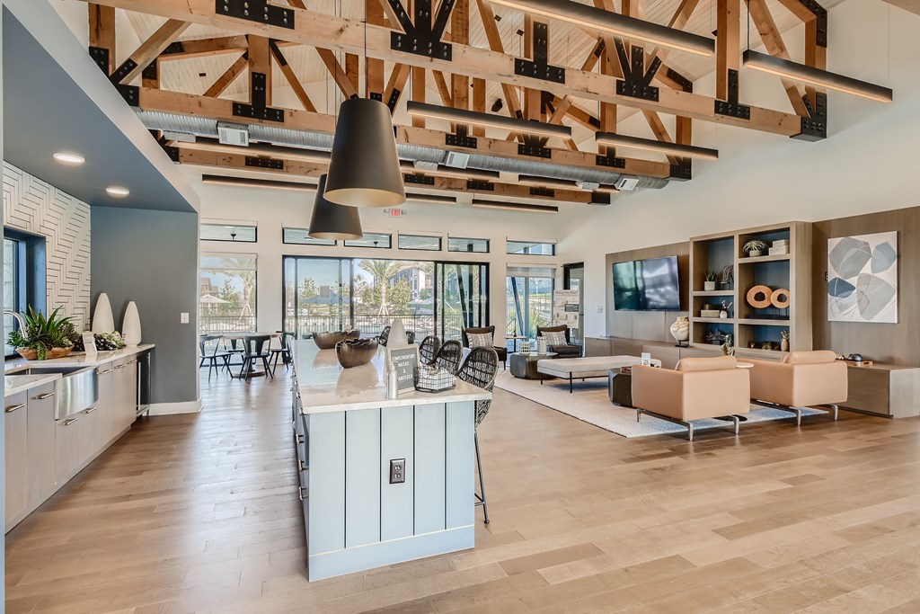 Resident clubhouse with communal kitchen and bar-style seating at Cypress McKinney Falls in Austin, TX