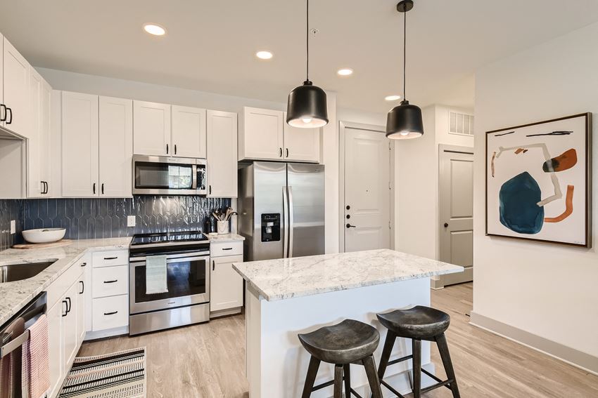 Modern kitchen with shaker-style cabinets and granite countertops at Cypress McKinney Falls in Austin, TX - Photo Gallery