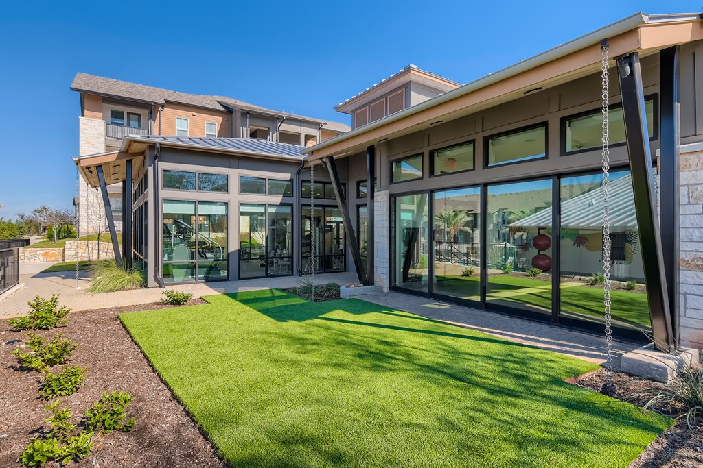 Communal green space outside the fitness center at Cypress McKinney Falls in Austin, TX