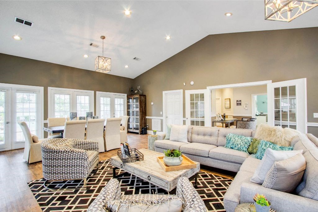 Leasing office and resident clubhouse with large sofa, oversized chairs at The Gables in Ridgeland, MS