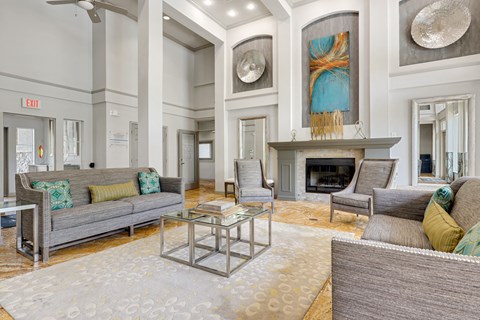 a living room filled with furniture and a fire place