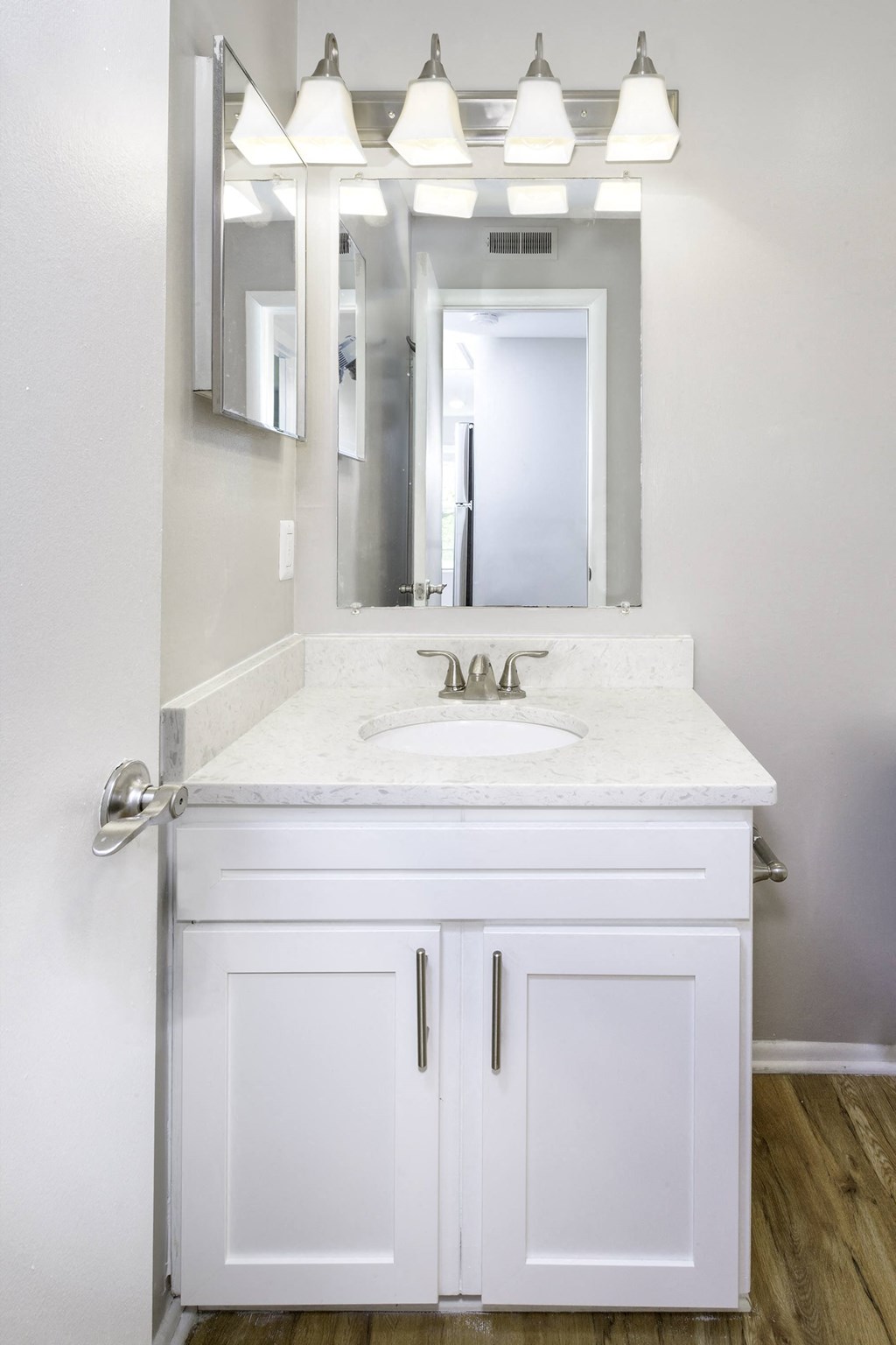 Renovated unit bathroom with granite countertops at  Springwoods at Lake Ridge
