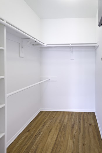 Renovated unit closet with built-in shelving at  Springwoods at Lake Ridge - Photo Gallery 17