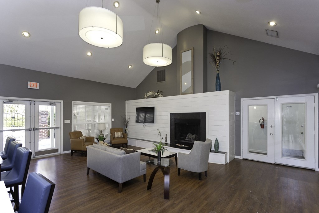 Interior of the leasing office and clubhouse with fireplace and seating areas at Windsor Park in Woodbridge, VA