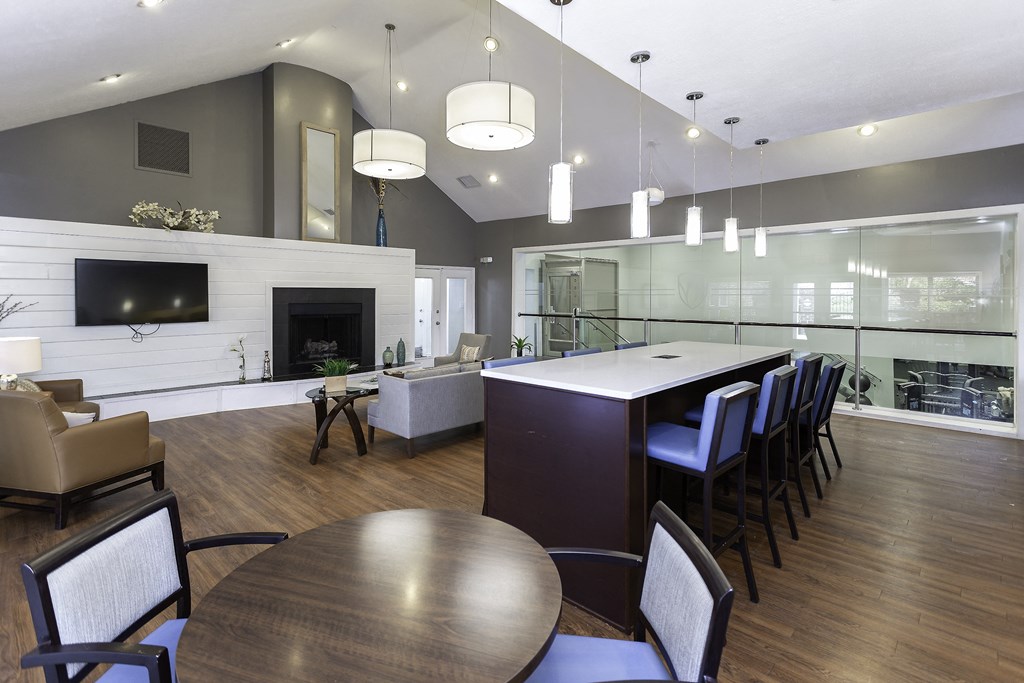Clubhouse with fireplace, TV, and seating areas at Windsor Park in Woodbridge, VA