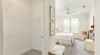 Bedroom walk-in closet in an apartment at The Retreat at Fairhope Village in Fairhope, AL