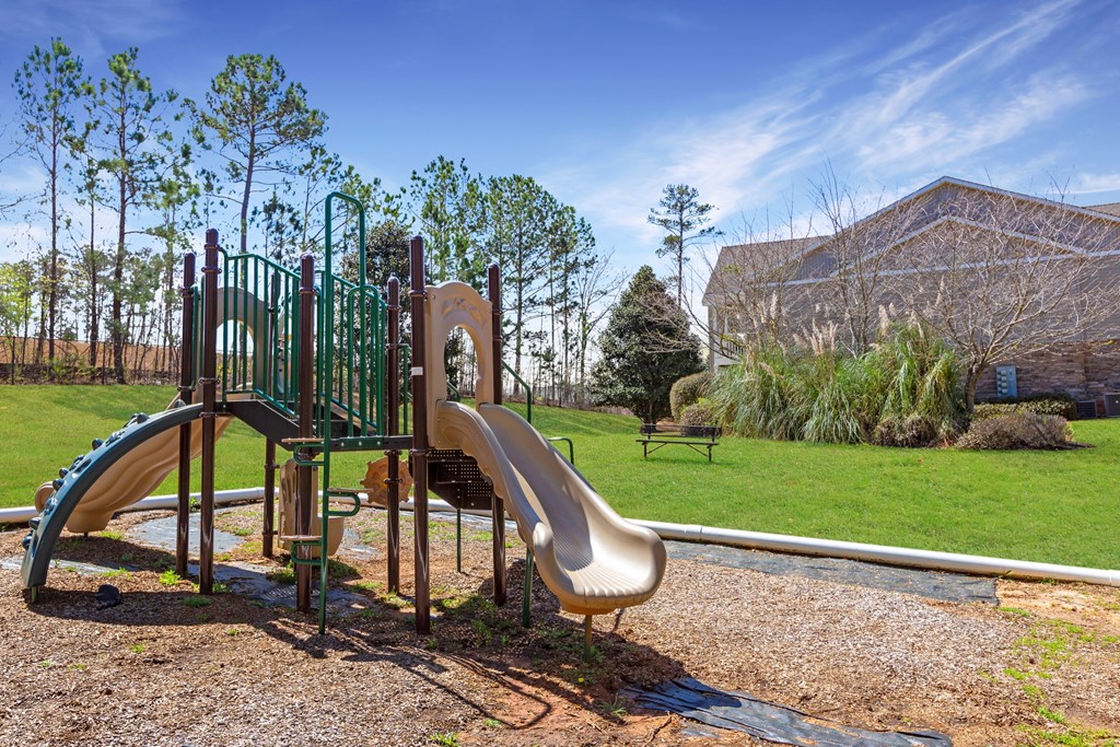 Children's playground and benches at Adrian on Riverside in Macon, GA