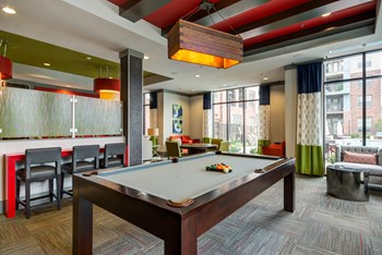 Resident clubhouse with billiard table and seating areas at Liberty Mill in Germantown, MD - Photo Gallery 5