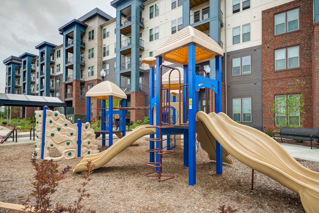 Children's playground set with slides and climbing wall at Liberty Mill in Germantown, MD