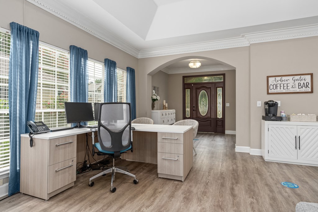 a home office with a desk and two chairs