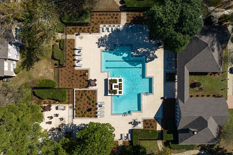 arial view of a house with a pool on top of it