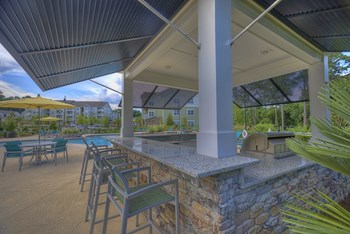 Poolside kitchen with bar-style seating at Lullwater at Blair Stone - Photo Gallery 3