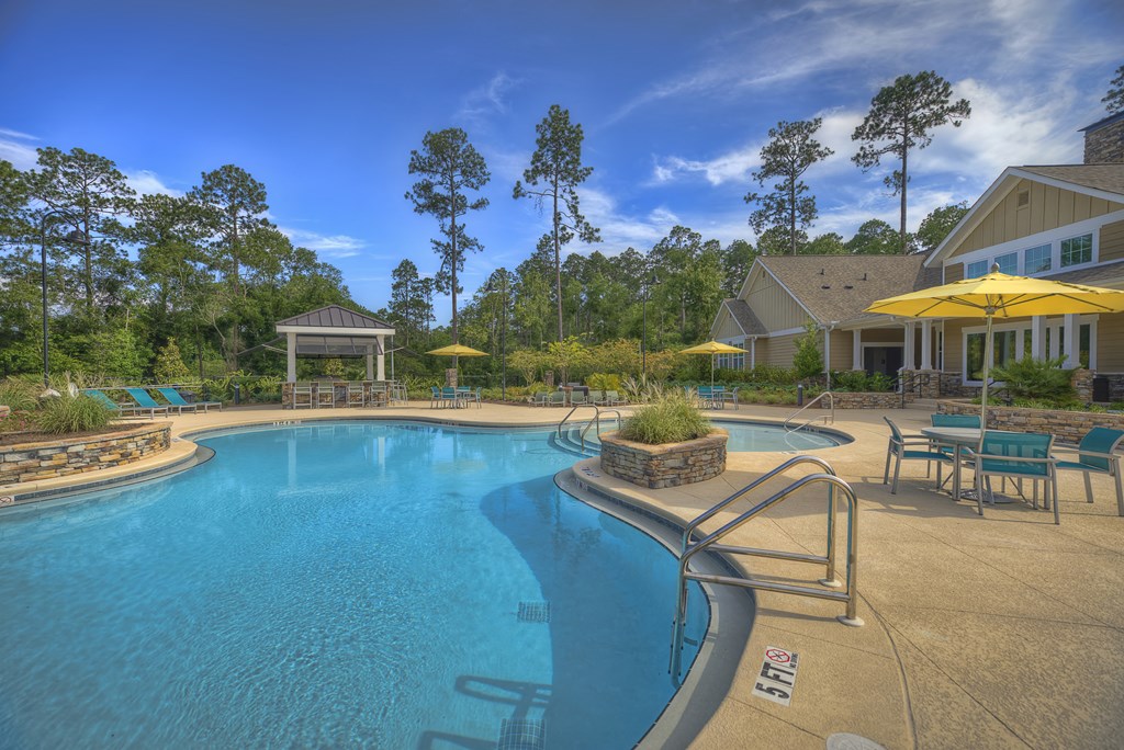 Resort-style swimming pool with sundeck and poolside kitchen at Lullwater at Blair Stone