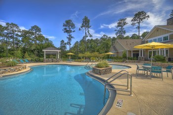 Resort-style swimming pool with sundeck and poolside kitchen at Lullwater at Blair Stone - Photo Gallery 2