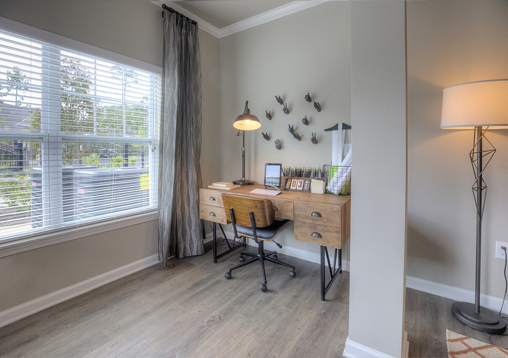 Workspace with a desk next to the window at Lullwater at Blair Stone