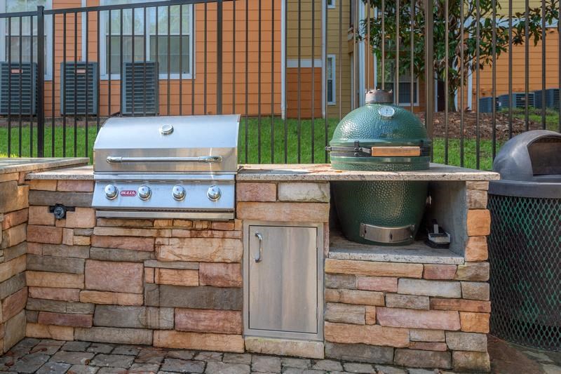 Grilling pavilion with two grills and brick designed flooring at Evergreens at Mahan apartments in Tallahassee, FL
