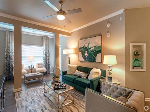 Sunroom with ample seating and ceiling fan at Lullwater at Blair Stone apartments for rent in Tallahassee, FL