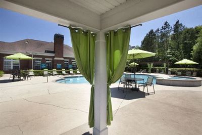 View from one of the poolside shaded cabanas looking out towards the pool at TEN35 Alexander Apartments