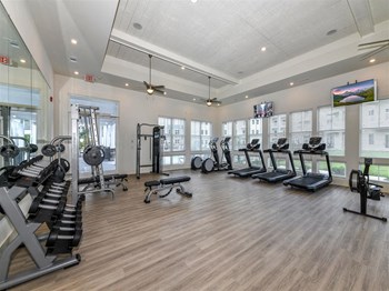 Equipped fitness center with weights and treadmills at The Station at Brighton in Grovetown, GA