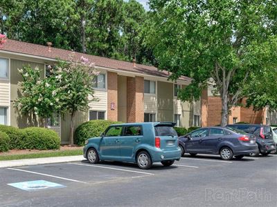 2-story apartment building at Ridgewood Apartments in Savannah, GA showing the apartment exterior and parking spaces