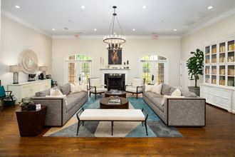 Leasing office and clubhouse interior with ample seating and a fireplace at Heritage at Riverstone in Canton, GA - Photo Gallery