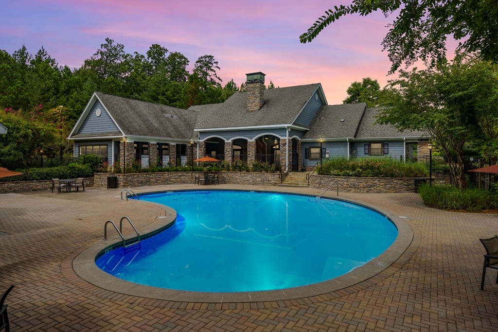 Heritage at Riverstone clubhouse and swimming pool at sunset in Canton, GA