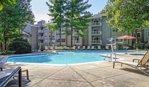our apartments offer a swimming pool with an apartment building in the background