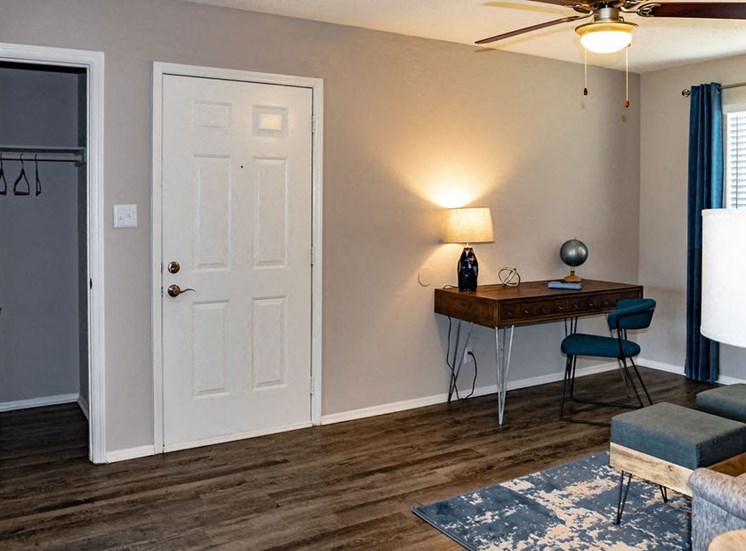 Living room with oversized closet at Forest Ride apartments
