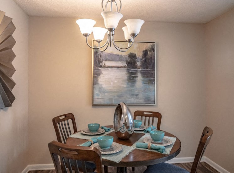 Dining area in Forest Pointe Macon apartment with table and chairs