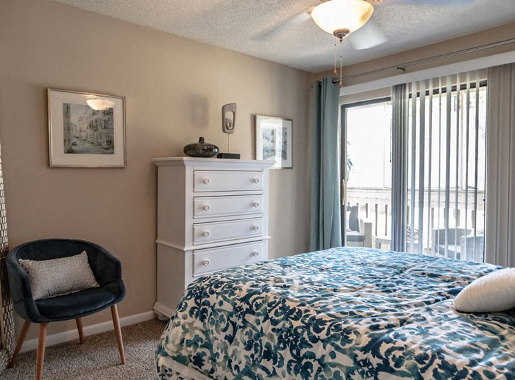 Forest Pointe apartment interior bedroom with sliding glass door