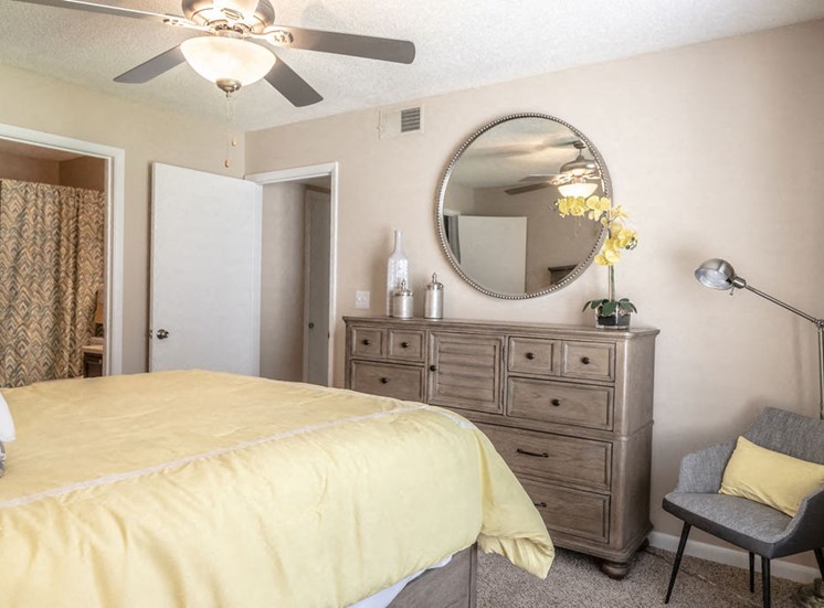 Forest Pointe apartment bedroom with bed and dresser