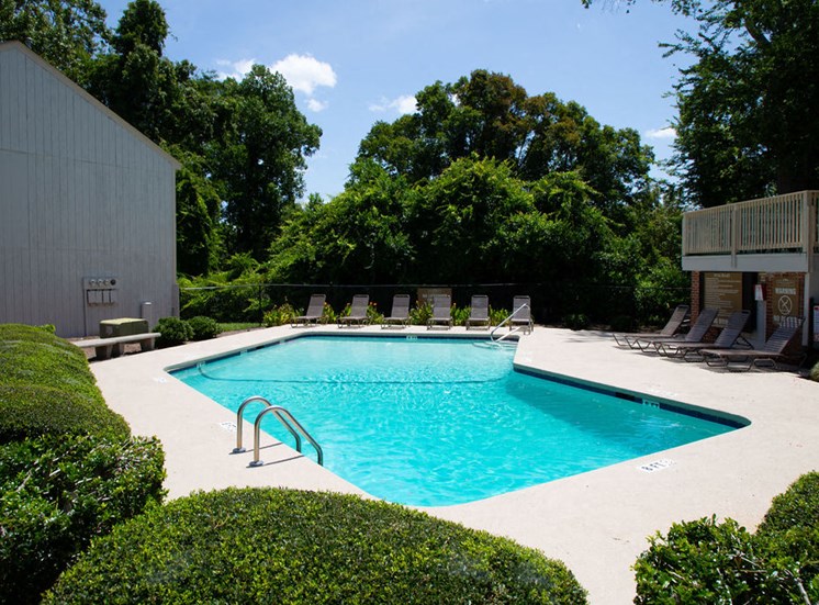 pool at apartments in Macon GA with poolside lounge chairs