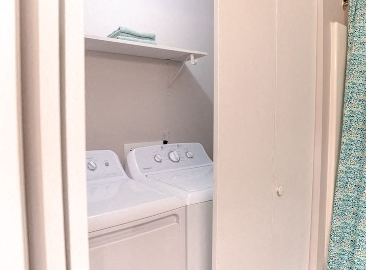 closet in Macon GA apartment with washer dryer and shelf
