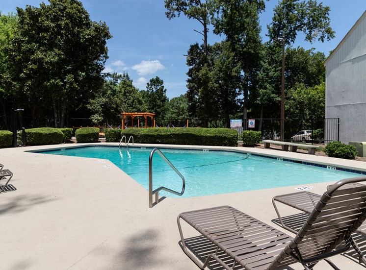 Macon GA apartments swimming pool and poolside lounge chairs
