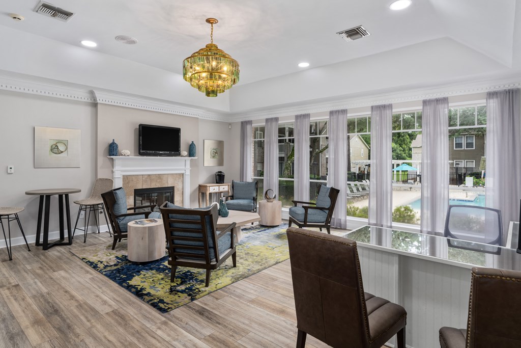 a living room filled with furniture and a large window