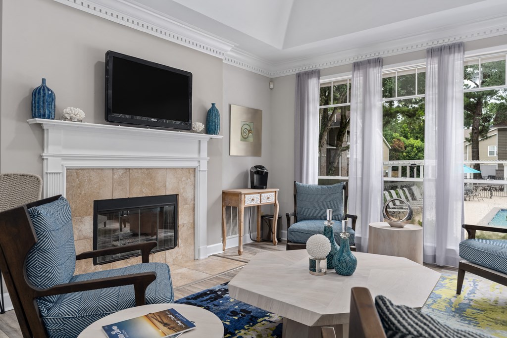 a living room filled with furniture and a flat screen tv