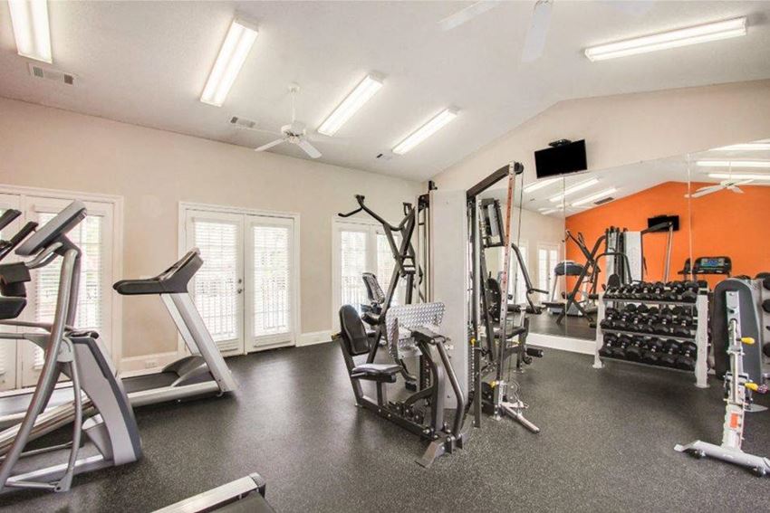 Inside premium fitness center with exercise equipment and soft flooring at The Gables apartments in Ridgeland, MS Inside premium fitness center with exercise equipment and soft flooring at The Gables apartments in Ridgeland, MS - Photo Gallery