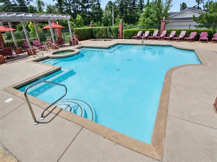 Outdoor sparkling swimming pool and spa with lounge chairs and umbrellas at The Gables apartments in Ridgeland, MS Outdoor sparkling swimming pool and spa with lounge chairs and umbrellas at The Gables apartments in Ridgeland, MS - Photo Gallery
