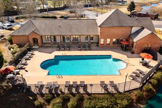 Aerial view of the clubhouse, swimming pool and sun deck at The Oaks of St. Clair