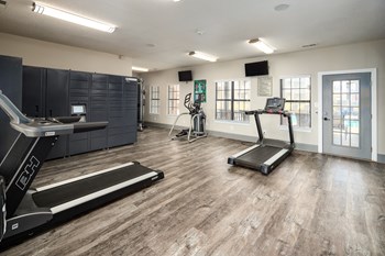 Fitness center and package concierge locker system at The Oaks of St. Clair in Moody, AL - Photo Gallery 7