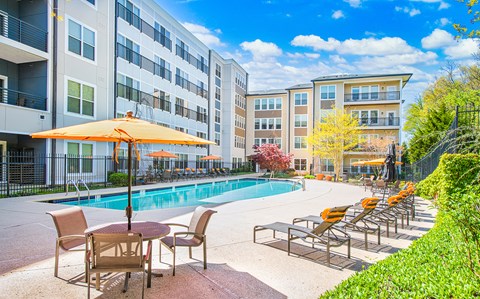 our apartments offer a swimming pool with patio furniture and umbrellas
