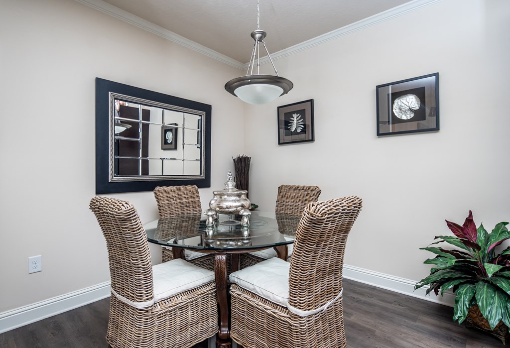 Dining area with circular table and four chairs at Riverstone apartments for rent in Macon, GA