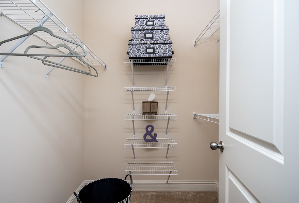 Walk-in closet with built-in shelves at Riverstone apartments for rent in Macon, GA