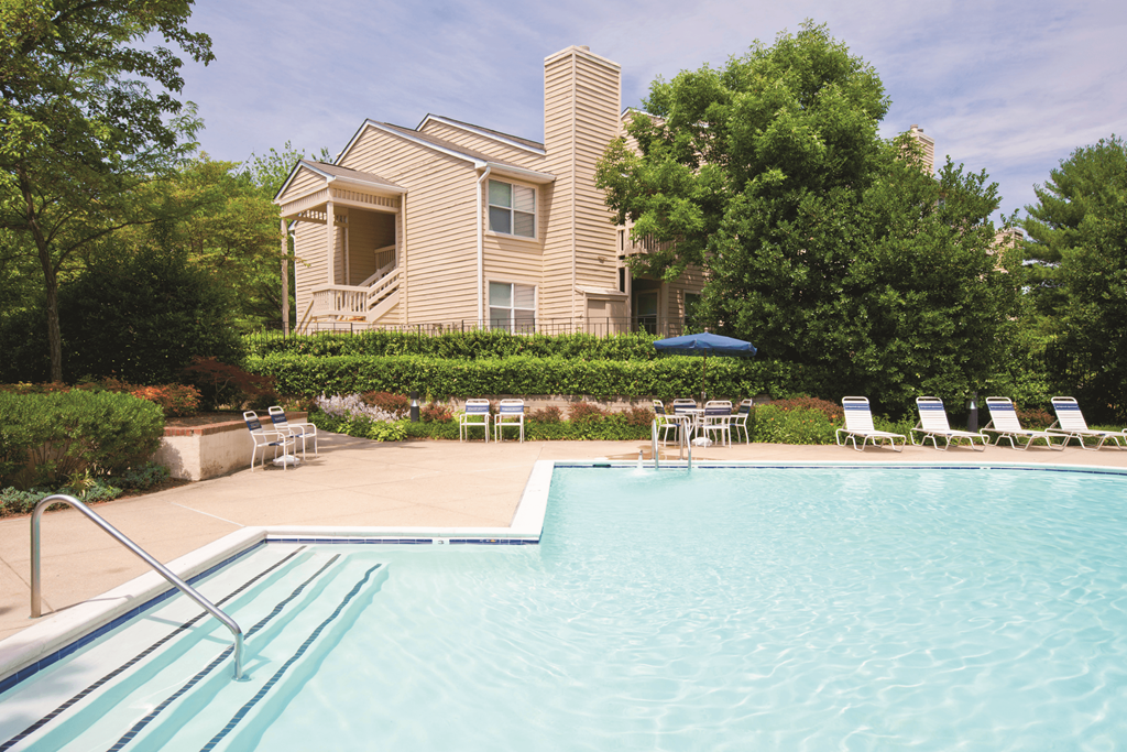 Overlooking the swimming pool towards a residential building at Springwoods at Lake Ridge