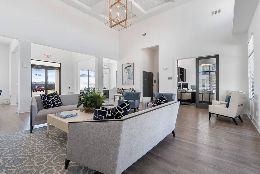 a living room with couches and chairs and a coffee table